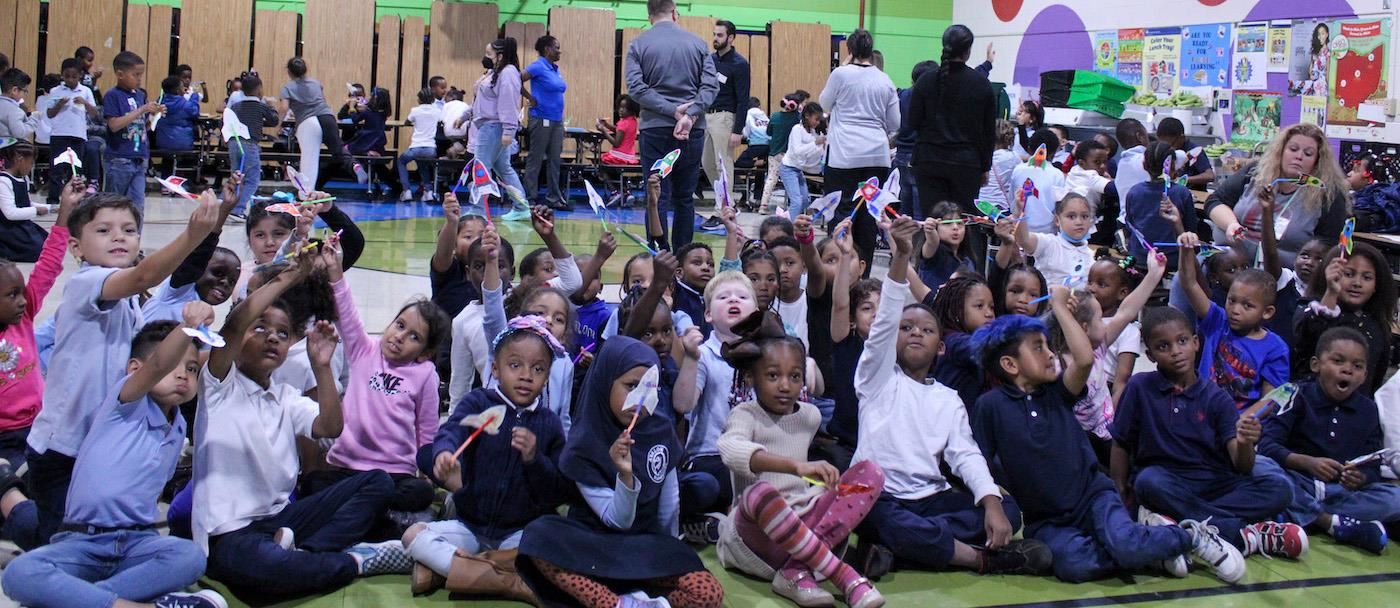 Students with paper rockets